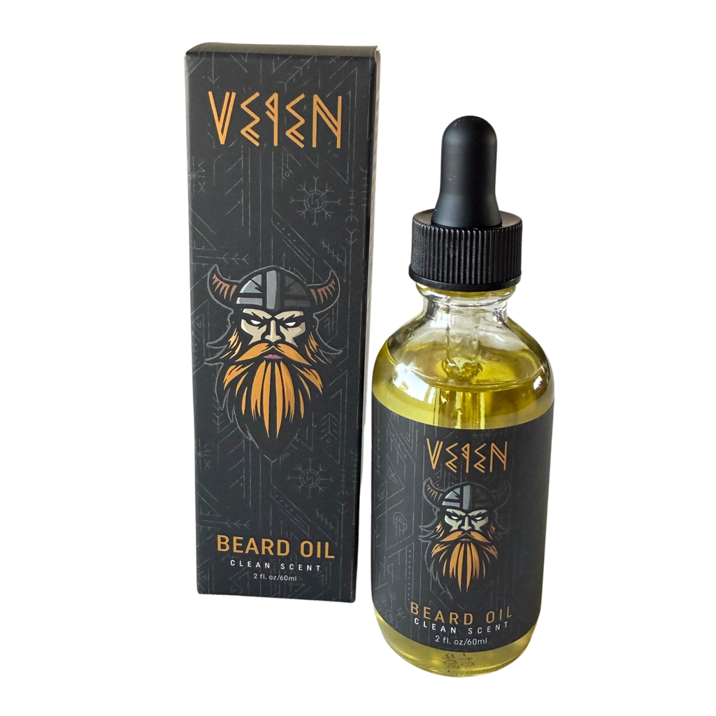 Veen Beard Oil in a clear glass bottle with a black dropper cap, shown next to its black packaging box featuring a Viking illustration.